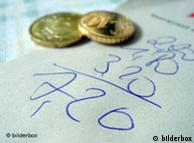 Euro coins and a written bill