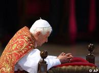 Pope Benedict XVI kneels during a service in St. Peter's Basilica 