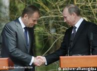 Poland's Prime Minister Donald Tusk and his Russian counterpart Vladimir Putin shake hands after giving statements in Katyn during a ceremony commemorating the 70th anniversary of the 1940 Katyn Massacre, 7 April 2010. 22,000 Polish officers, uniformed servicemen and intellectuals were executed by the Soviet NKVD in the nearby Katyn Forest. 