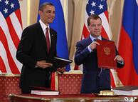 Barack Obama holds the newly-signed START treaty with Russian president Dmitry Medvedev 