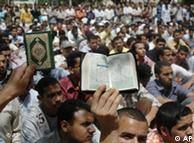 Muslim Brotherhood students hold a copy of the Quran during a protest at the al-Azhar university 