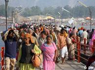 Devotees crossing the bridge that spans the Ganges