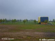 Lithuanian pavilion standing alone in an empty field