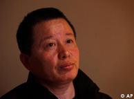 Gao Zhisheng, a human rights lawyer, pays attention to a question during his first meeting with the media since he resurfaced two weeks ago, at a tea house in Beijing, China, Wednesday, April 7, 2010. Gao, whose disappearance more than a year ago caused an international outcry, said Wednesday that he is abandoning his once prominent role as a government critic in hopes of reuniting with his family. In the meeting, Gao said he did not want to discuss his disappearance. (AP Photo/Gemunu Amarasinghe)