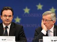 Greek Finance minister Giorgios Papakonstantinou, left, and Chairman of the Eurogroup Jean-Claude Juncker, address the media at the European Council building in Brussels, Sunday, May 2, 2010. Finance Ministers of the 16 nations using the euro met on Sunday to review a proposed bailout for Greece. (AP Photo/Yves Logghe)