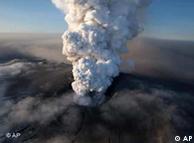 Icelandic volcano crater spewing ash and plumes of grit 