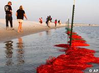 Netting along the beach that is expected to keep oil off the shore