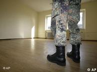 Soldier standing in an empty room