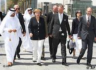 German Chancellor Angela Merkel, center left, arrives for a tour of the Museum of Islamic Art in Doha