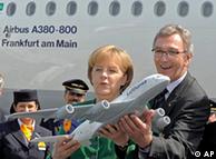 Wolfgang Mayrhuber, Chairman and CEO of Deutsche Lufthansa, right,  and German Chancellor Angela Merkel hold a mock up of an Airbus A380 aircraft in front of the Airbus A380 'Frankfurt am Main' 