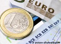 A euro coin and banknote