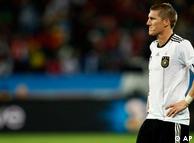 Germany's Bastian Schweinsteiger reacts after Spain's Carles Puyol, not visible, scored a goal.