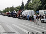 Trucks are lined up for the second day at the side of the national highway outside Athens
