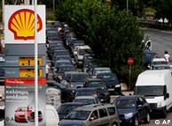 Motorists line up at a gas station, amid shortages in Athens