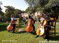 Students practice outdoors in front of the school