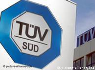 TUEV SUED's logo before one of its buildings