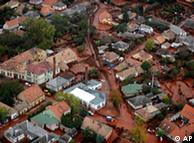 An aerial view of streets covered with red mud