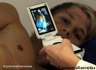 A man is scanned with an ultrasonic device
