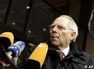 German Finance Minister Wolfgang Schaeuble speaks with the media as he arrives for a meeting of the eurogroup at the EU Council building in Brussels on Monday, Dec. 6, 2010. European nations were under pressure to commit more money to help stabilize the euro, as finance ministers gathered in Brussels to find ways to fight the debt crisis that has rocked the currency bloc. (AP Photo/Virginia Mayo)