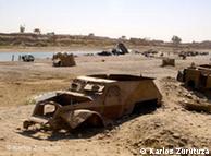 Stripped-down jeep carcass on a roadside in Helmand