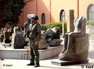 An Egyptian army soldier stands guard near antiquities of the Egyptian museum in Cairo