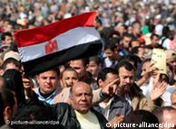 A huge crowd of Egyptians waving their flags in a Cairo square