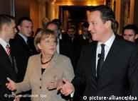 German Chancellor Angela Merkel (l) gestures besides British Prime Minister David Cameron