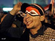 Man with face painted in colors of Egyptian flag