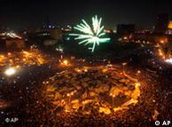 A crowd of Egyptians lights fireworks in celebration