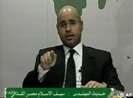 In this video image broadcast on Libyan state television early Monday Feb. 21, 2011 Seif al-Islam, son of longtime Libyan leader Moammar Gadhafi, speaks. Al-Islam says protesters have seized control of some military bases and tanks, and also warned of civil war in the country that would burn its oil wealth. (AP Photo/Libyan State Television) TV OUT LIBYA OUT