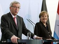 German Chancellor Angela Merkel, right, and the Prime Minister of Luxembourg, Jean-Claude Juncker, left, address the media during a joint news conference after a meeting at the chancellery in Berlin, Germany, Friday, March 4, 2011. (AP Photo/Michael Sohn)