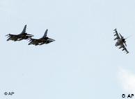 Danish air force F-16 fighter planes maneuver as they prepare for landing at the Nato airbase in Sigonella, Italy, Saturday, March 19, 2011. NATO's top decision-making body is meeting in emergency session Saturday to review military plans for a no-fly zone over Libya. The North Atlantic Council is expected to issue the order to launch the operation during this weekend. Officials said the military staff was putting the final touches on plans to deploy dozens of fighter-bombers, tankers, helicopters and surveillance planes to several air bases along Europe's southern rim. (AP Photo/Andrew Medichini)