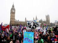 Demonstrators march past Parliament Square in London 