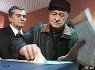 An Sarajevan casting his ballot at a polling station