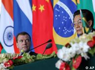 Russian President Dmitry Medvedev, left, looks at Chinese President Hu Jintao at a joint press conference during the BRICS Summit in Sanya, Hainan province, China, on Thursday April 14, 2011. (AP Photo/How Hwee Young, Pool)