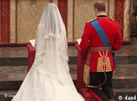Kate and William kneel at the altar during their wedding service 