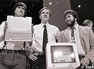 In this April 24, 1984 file photo, Steve Jobs, left, chairman of Apple Computers, John Sculley, center, then president and CEO, and Steve Wozniak, co-founder of Apple, unveil the new Apple IIc computer in San Francisco. 