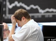 Trader holds head while Dax plummets in background
