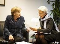 Merkel and IMF chief Christine Lagarde (right)