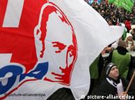 Activists of the pro-Kremlin youth movement Nashi hold flags with portraits of Russian Prime Minister Vladimir Putin