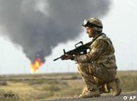 A member of 3 Regiment Army Air Corps, serving with the British Army's 16 Air Assault Brigade, keeps watch Saturday March 22, 2003, after securing the North Ramala oilfield in Iraq. 